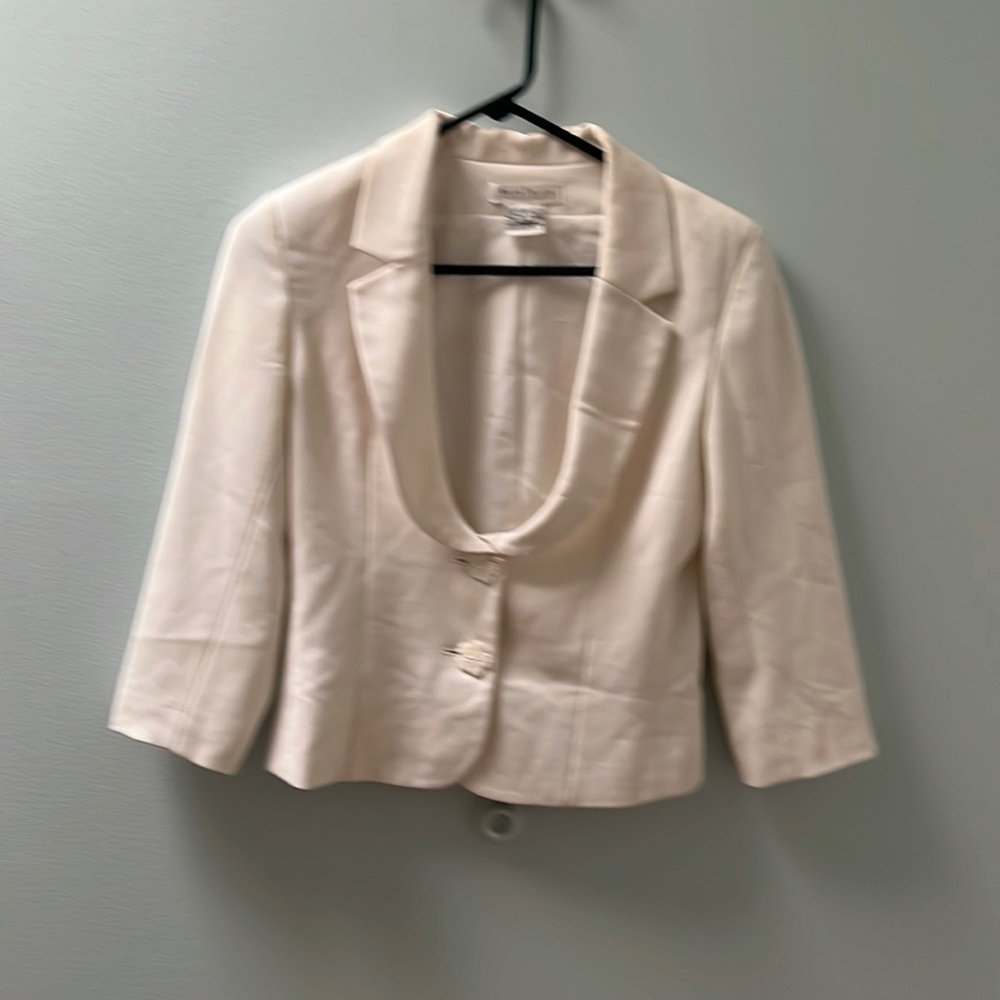 Cream colored work jacket.